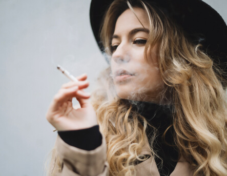 stylish-woman-with-cigarette-2023-11-27-05-03-13-utc 1 (1) (1)